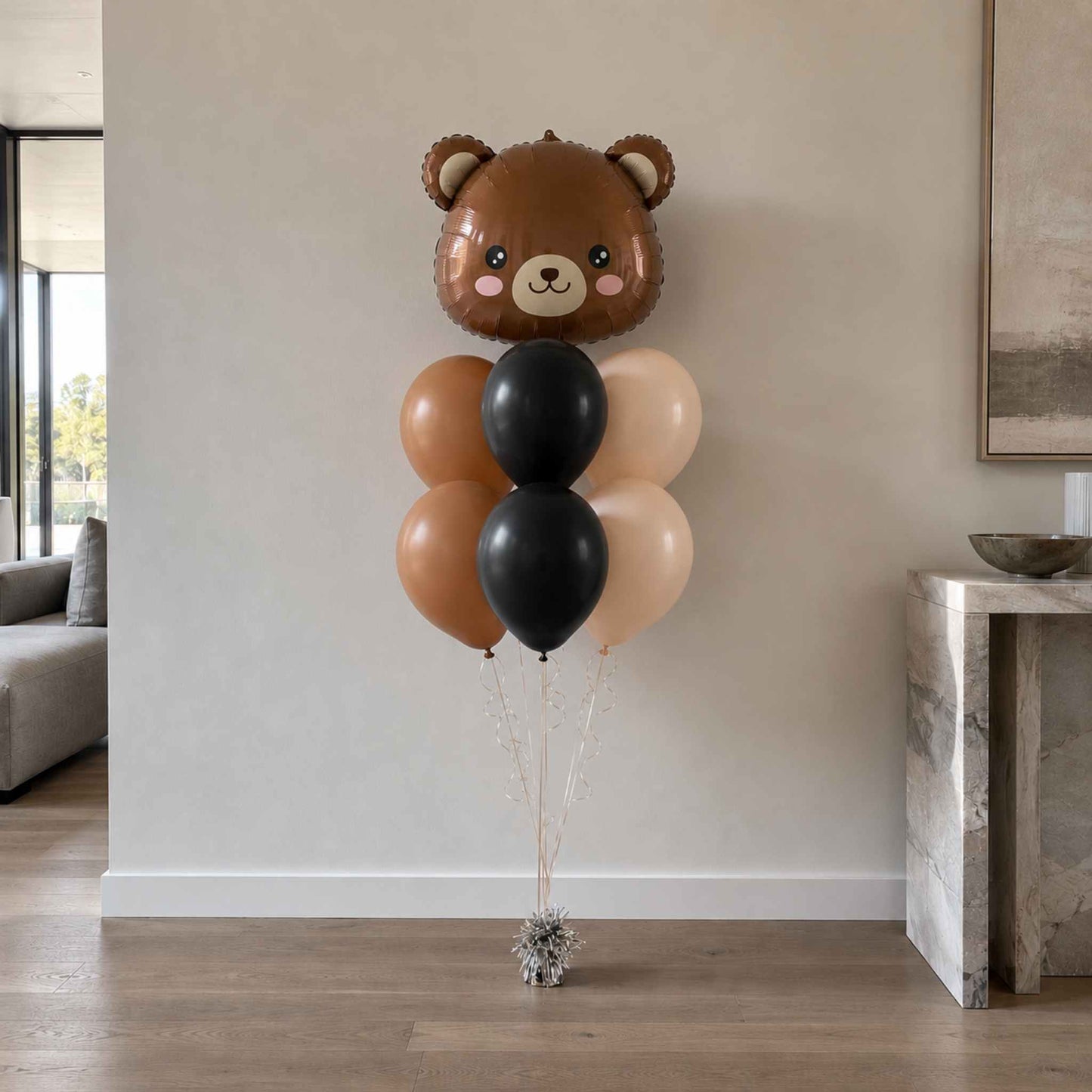 Balloon bouquet with a bear design in a living room setting
