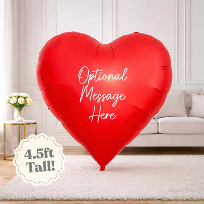 Red heart-shaped balloon with 'Optional Message Here' text in a living room setting.