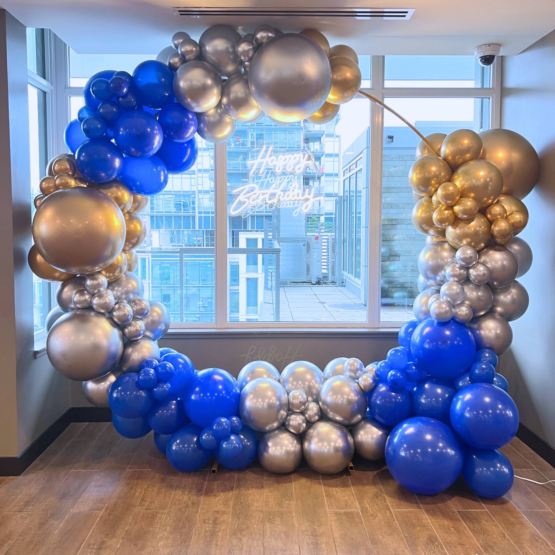 blue gold and silver chrome balloons circle backdrop