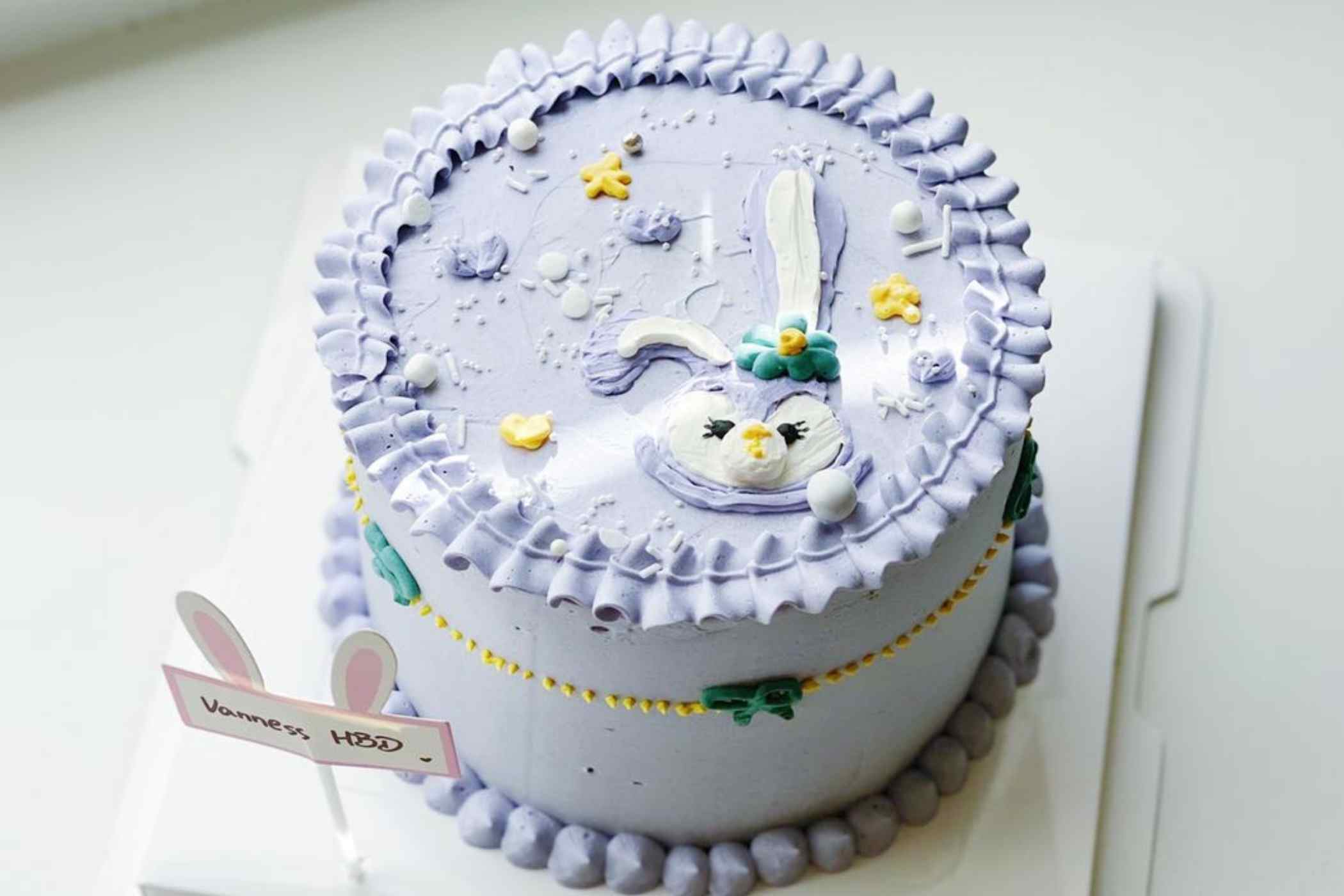Decorative cake with a cartoon character on a white background