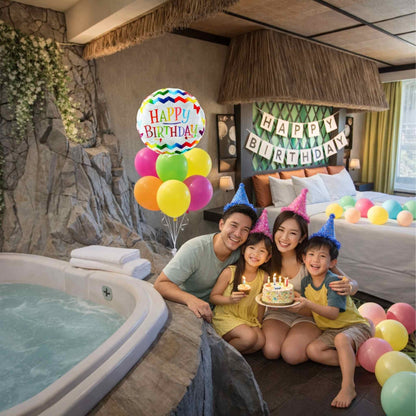 Family celebrating a birthday in a spa with balloons and cake