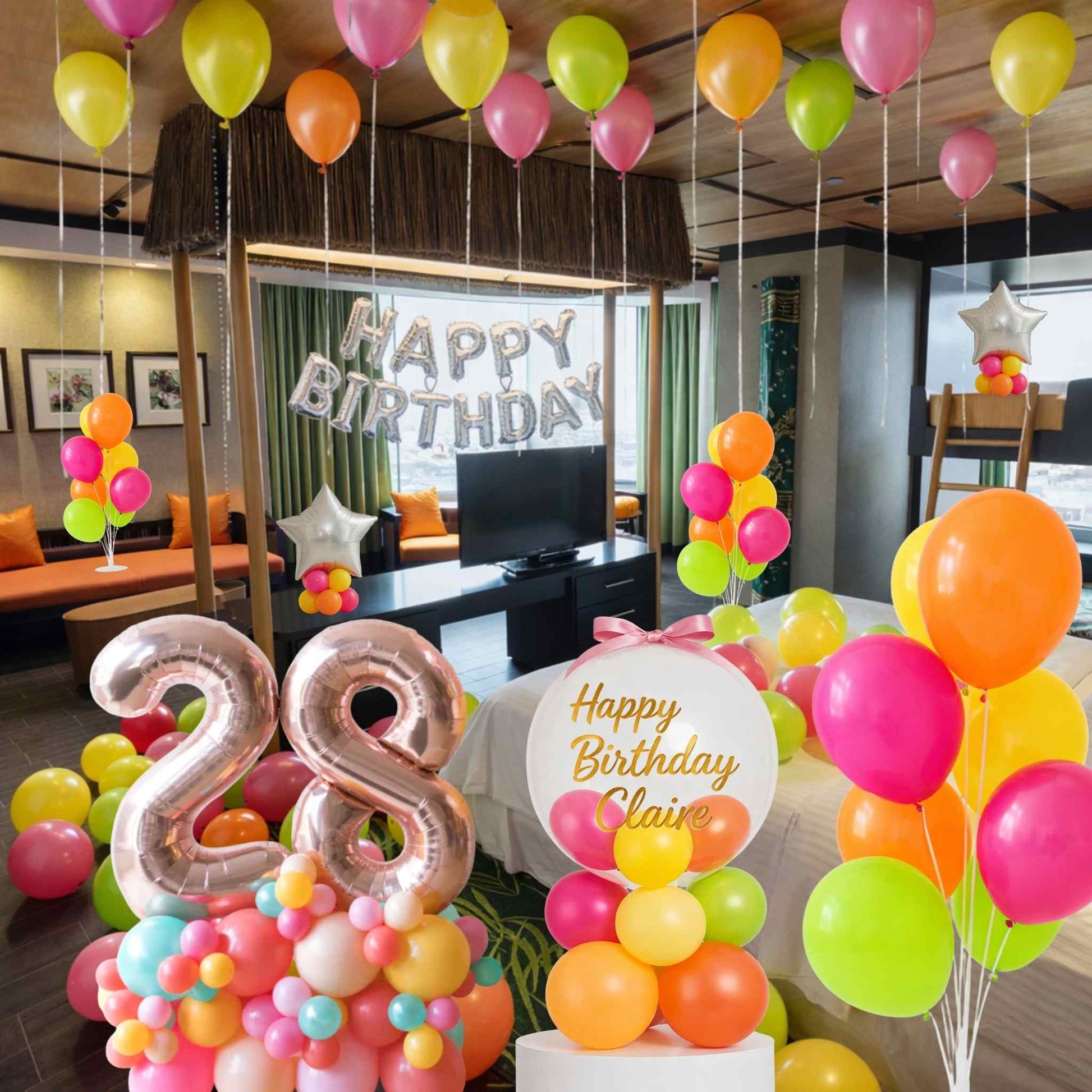 Birthday celebration with colorful balloons and decorations in a room.