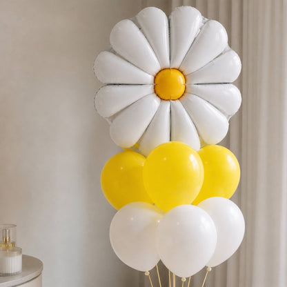 Decorative wall art with a white daisy and yellow and white balloons against a neutral background.